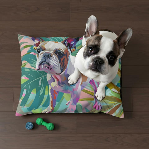 Dog lying on a colorful pillow with a leaf pattern on a wooden floor.